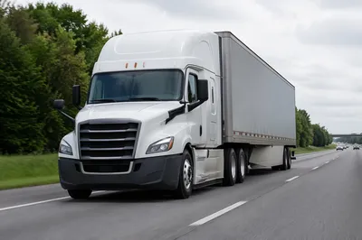 White Semi Truck on Suburban Highway