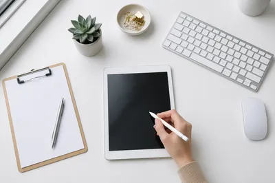 Stylus Writing on Tablet Business Workspace