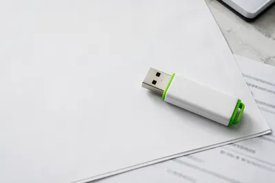 White USB Drive on Minimal Office Documents