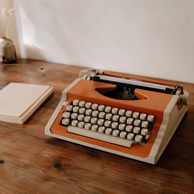Vintage Typewriter on Rustic Wooden Desk