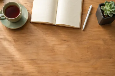 Minimalist Morning Desk With Tea and Journal