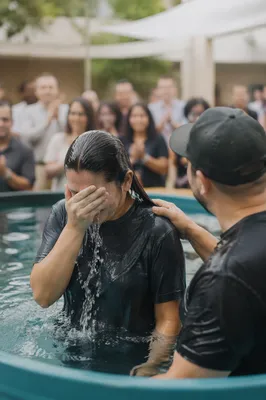 Adult Baptism in Church Courtyard Pool