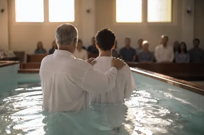 Adult Baptism in Warm Church Light