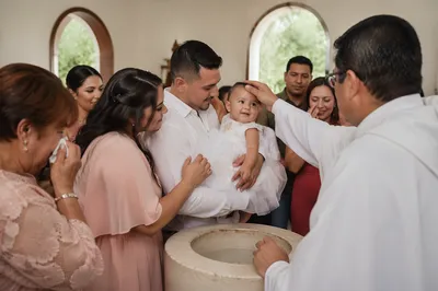 Joyful Family Infant Baptism in Church