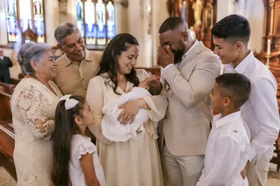 Family Celebrating Baptism Inside Bright Church