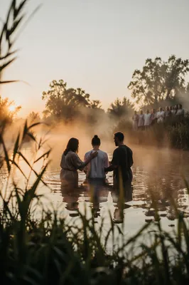 Peaceful Sunrise Baptism in Outdoor River