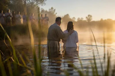 Peaceful Outdoor River Baptism at Sunrise