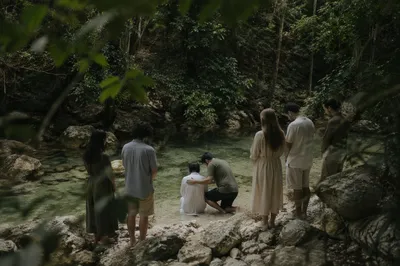 Reverent Outdoor River Baptism in Wooded Creek