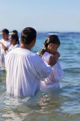 Coastal Baptism in White Robes