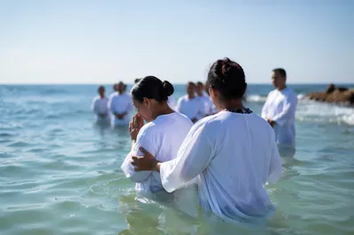 Coastal Baptism in White Robes