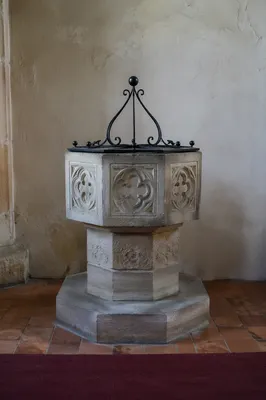 Traditional Stone Baptismal Font in Old Church