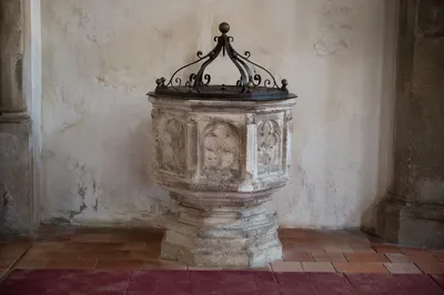 Traditional Stone Baptismal Font in Old Church