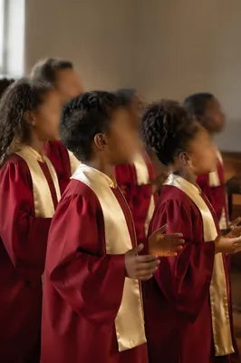 Children Singing in Crimson Church Choir Robes