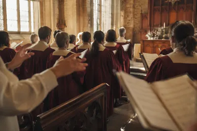 Church Choir Singing in Burgundy Robes