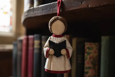 Handmade Choir Robe Ornament on Music Shelf