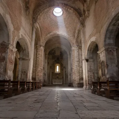 Ancient Church Aisle Toward Sunlit Altar