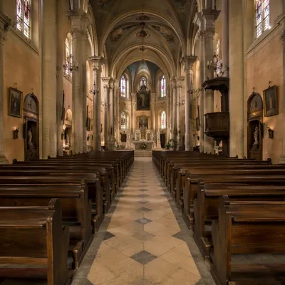 Historic Church Aisle Toward Softly Lit Altar