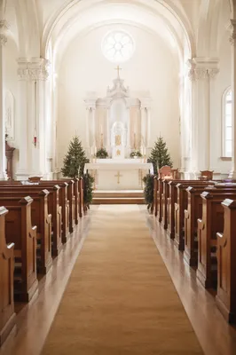 Serene Church Aisle Toward Bright Altar