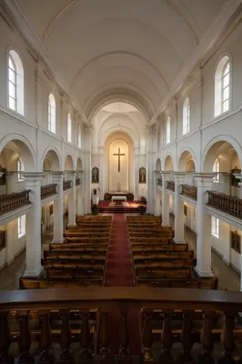 Serene Church Aisle Toward Altar Cross