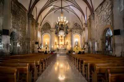 Historic Church Aisle Toward Glowing Altar