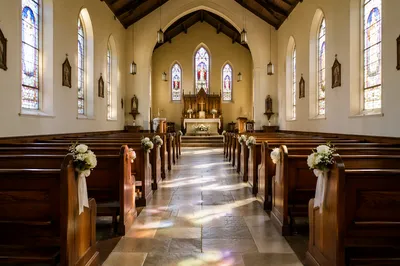 Peaceful Church Aisle Toward Softly Lit Altar