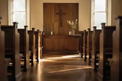 Quiet Church Aisle Toward Wooden Altar