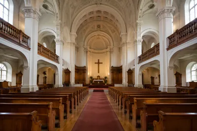 Historic Church Aisle Toward Candlelit Altar