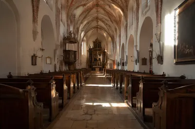 Historic Church Aisle Toward Glowing Altar