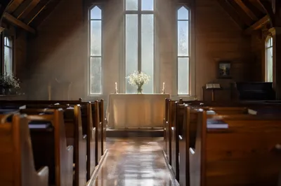 Quiet Chapel Aisle Toward Simple Altar