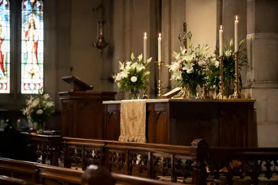 Historic Church Altar with Candles and Flowers