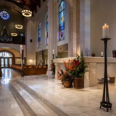 Church Altar Flowers and Candlelit Sanctuary