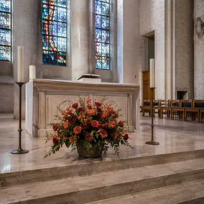Church Altar Flowers and Candlelit Sanctuary