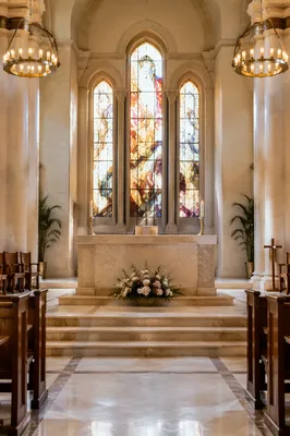 Serene Church Altar with Flowers and Candles