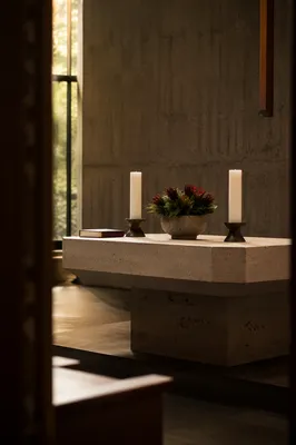 Quiet Church Altar with Flowers and Candles
