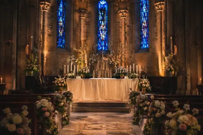 Candlelit Church Altar with Elegant Flowers