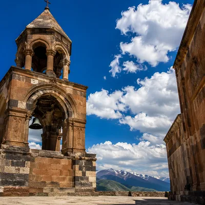 Ancient Church Bell Tower Under Blue Sky