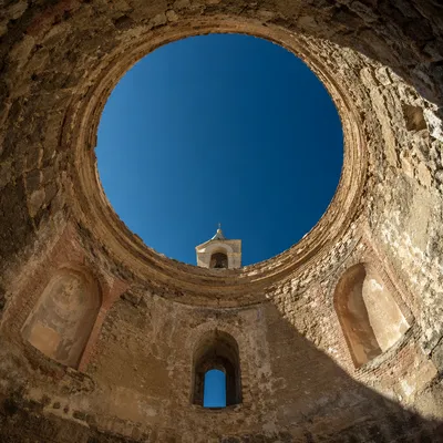 Historic Church Oculus Framing Blue Sky