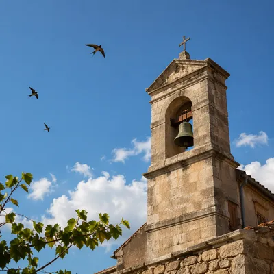 Stone Church Bell Tower Under Blue Sky