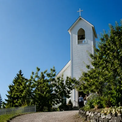 White Church Bell Tower Under Blue Sky