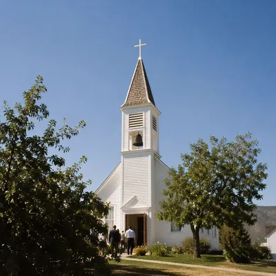White Church Bell Tower Under Blue Sky