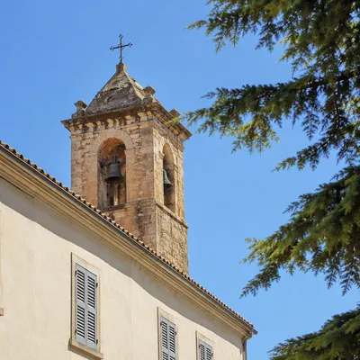 Historic Church Bell Tower Under Blue Sky
