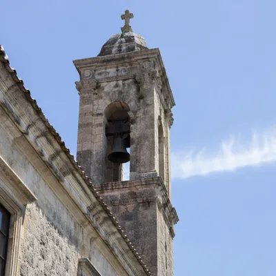 Historic Church Bell Tower Under Blue Sky