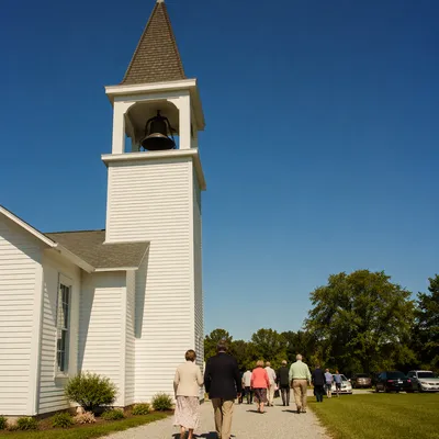 White Church Bell Tower Under Blue Sky