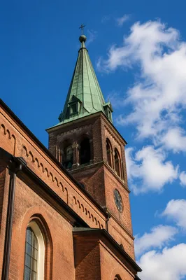 Historic Church Bell Tower Under Blue Sky
