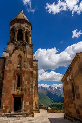 Ancient Church Bell Tower Under Blue Sky