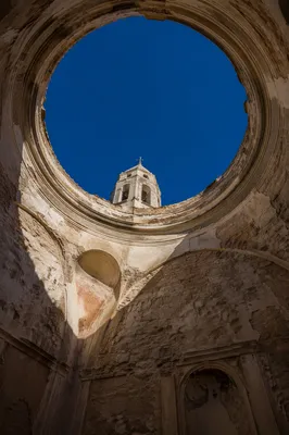 Church Bell Tower Framed by Ancient Oculus