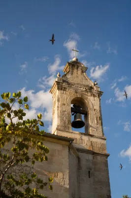 Stone Church Bell Tower Under Blue Sky