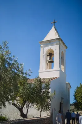 White Church Bell Tower Under Blue Sky
