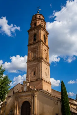 Historic Brick Church Bell Tower Under Blue Sky
