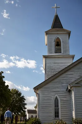 White Church Bell Tower Under Blue Sky